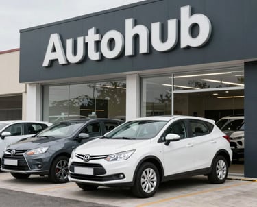 A sleek, modern showroom interior with a selection of polished used cars under soft lighting.