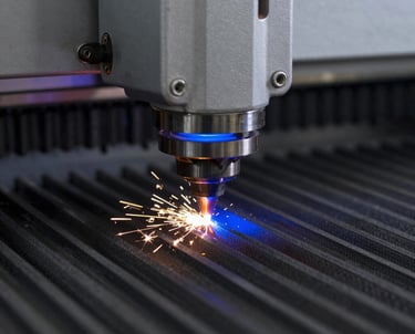 A high-contrast macro shot of a laser cutting head in a fabrication lab, with sparks and a blue glow. The focus is on the precision and technical nature of the process.