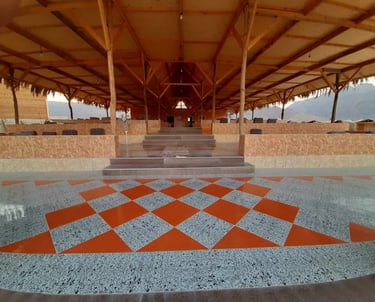 Sinai Life Camp restaurant with ceramic floors, high ceilings, and Bedouin cushion seating on the Nuweiba beach.