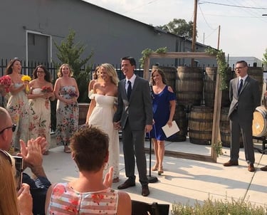 Wedding officiant with happy couple