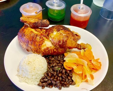Las Brasas restaurant roast chicken dinner with flavorful sauces