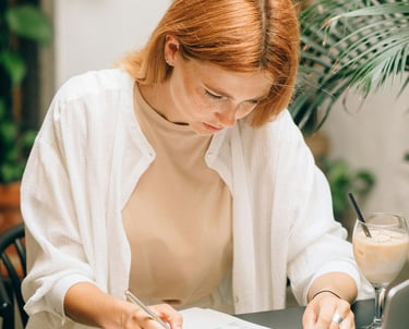 Image of a researcher writing a scientific paper