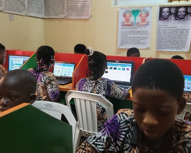A group of pupils learning digital literacy in their school's computer lab