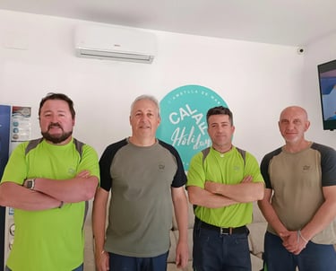 a group of men standing in front of a television