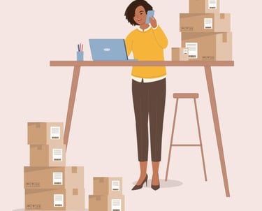 Female entrepreneur managing e-commerce shipping and orders with laptop and boxes.