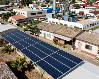 Surveillance cameras mounted on a building corner overlooking a parking lot.