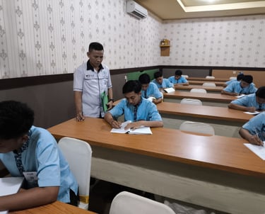a man standing in front of a classroom with a teacher