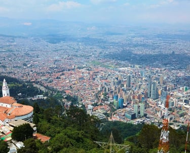 Panoramic aerial view of Bogota city skyline from the Monserrate sanctuary hilltop in Colombia.