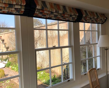 3 hand sewn blinds in an orangery with contrast borders