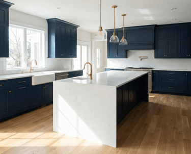Luxury kitchen renovation in Virginia Beach with navy blue shaker cabinets, quartz countertops, and gold hardware fixtures.