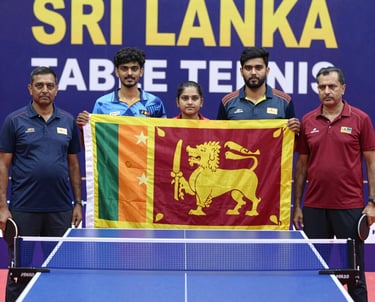 A focused Sri Lankan table tennis player in action, mid-smash with intense determination.