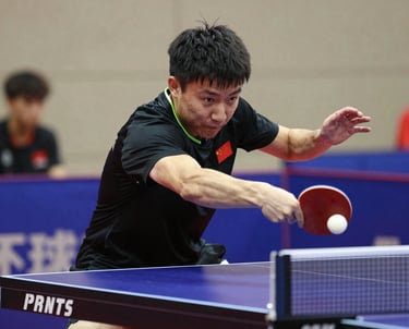 Sri Lankan table tennis coaches mentoring players during an outdoor training session under a bright sky.