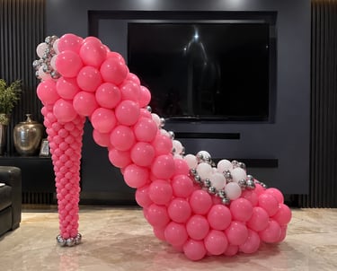 Barbie pink high heel themed birthday balloon display for children’s party in Liverpool