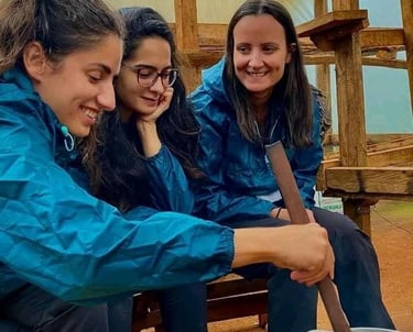 Happy travelers wearing blue rain jackets during a guided tour or outdoor adventure group trip