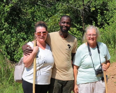 Professional safari guide with tourists during a Murchison Falls National Park trip in Uganda.