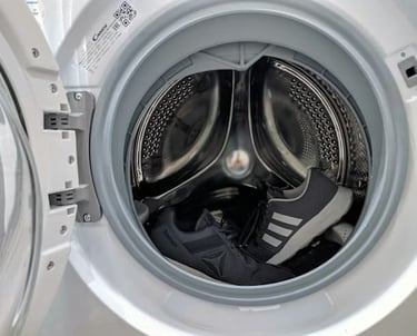 handyman working on a washer and dryer