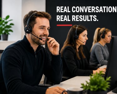 Smiling customer support representative with headset working in a busy call center office.