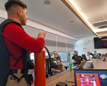 Professional fire safety instructor demonstrates fire extinguisher use to office employees during a training seminar.