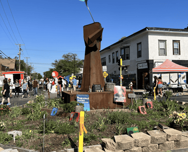 A metal fist sculpture with a Pan-African flag at a street memorial for George Floyd in Minneapolis.