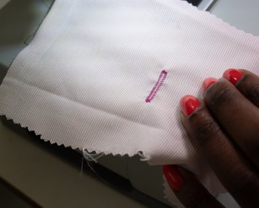 Buttonhole stitch shown on pink fabric