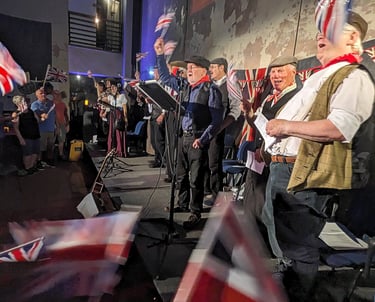 Crowd waving union flags at Sandfields Pumping station
