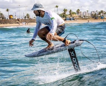 a man is surfing on a surfboard in the ocean