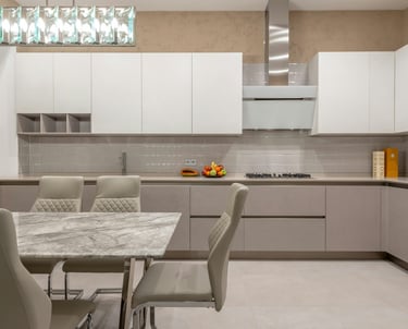 a kitchen with a marble table and chairs