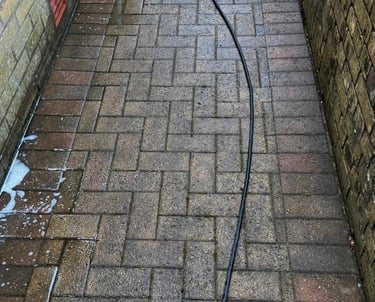 a hose is attached to a brick wall