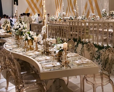 Premium wedding reception table setup with gold decor and floral design in Bodrum