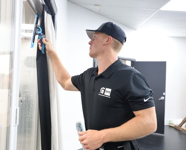 luke squeegeeing a window