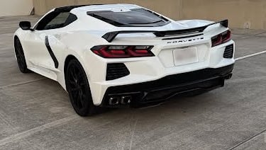 Rear view of 2023 Corvette 3LT with white paint and black trim