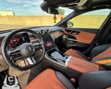 Mercedes C300 interior dashboard with leather seats and dual screen display