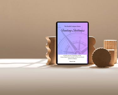 a tablet with a digital ebook cover 'finding stillness' on it