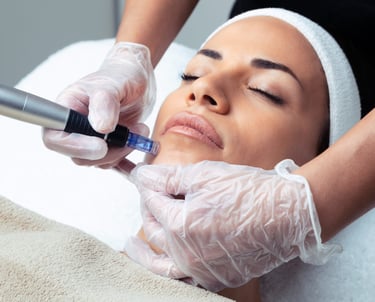 a woman getting a facial lift from a woman in a white towel