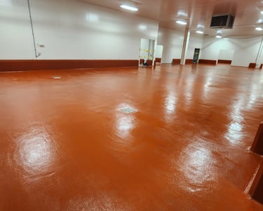 Polyurethane cement flooring system for heavy-duty industrial environments dairy processing