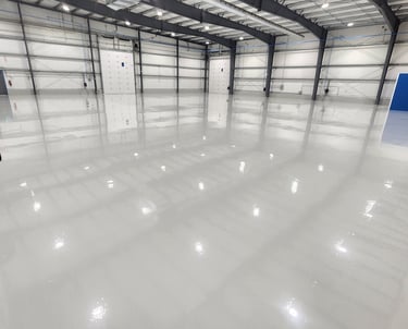Industrial epoxy flooring system installed in a automotive garage environment