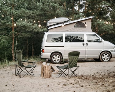 A Campervan with a rooftop tent, ready for a camping adventure.