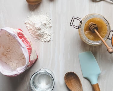 a table with a cake ingredients