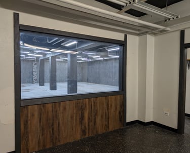 Observation room overlooking a studio through a large window