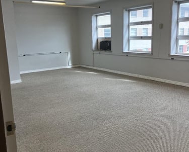 Unfurnished office with 3 windows along 1 wall