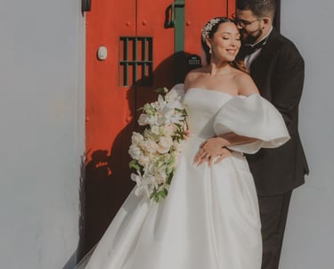 Antigua Guatemala Wedding Photographer-bride and groom resting on red door