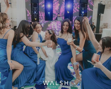 Bride dancing with bridesmaids