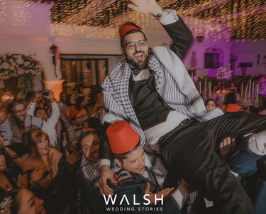 Antigua Guatemala Wedding Photographer-Groom carried by guys at party
