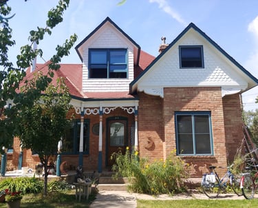 A classic 100 year old Victorian painted after 20 years of Colorado high mountain weather.