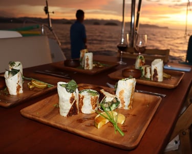 Gourmet appetizers served at sunset onboard private catamaran in Papagayo Gulf