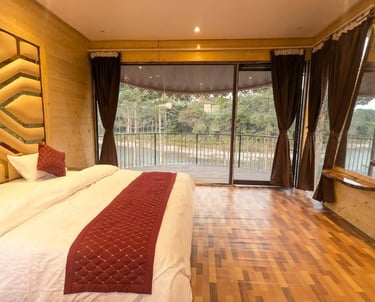 a luxury bedroom with a bed and reiver front balcony