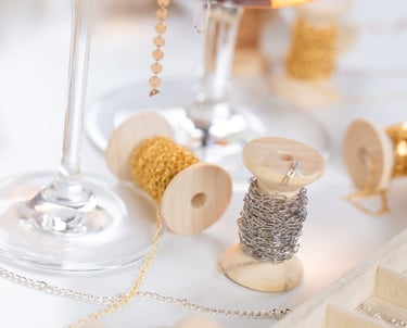 a wine glass with permanent jewelry chains