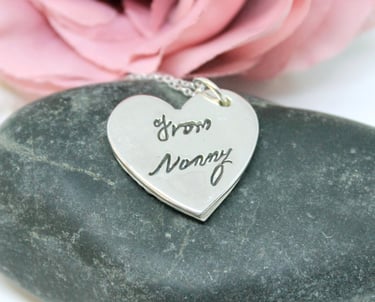 Silver memorial jewellery with a heart pendant and a loved one's real handwriting.