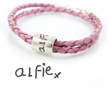 Silver signature jewellery. A leather bracelet with a signature bead.