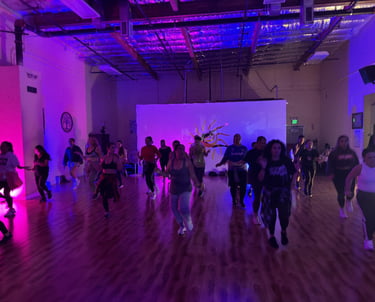 A group of dancers dancing towards the camera.